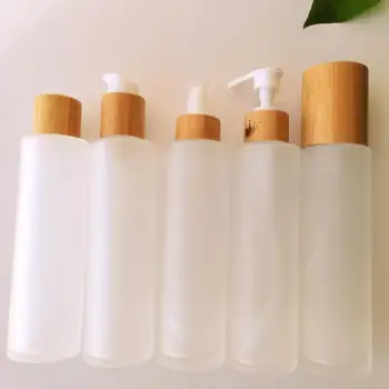Роскошные бутылки из бамбукового дерева, покрытые колпачком для насоса, колпачок для шампуня, бутылки из матового стекла, контейнер для макияжа Изображение